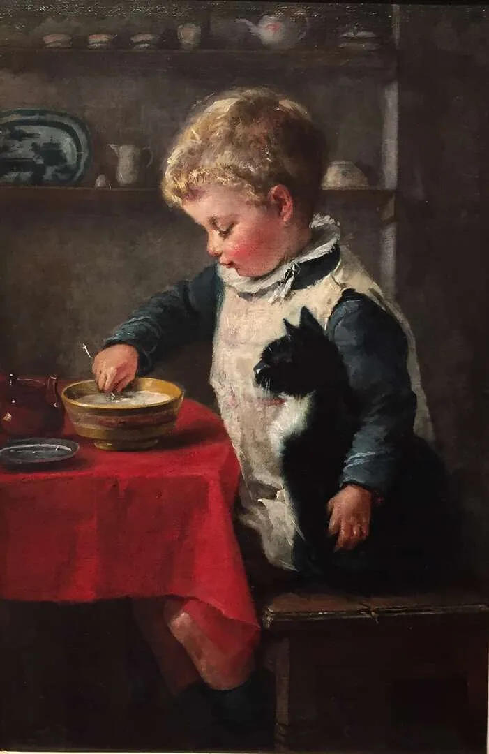 Charlotte Weeks: Jongen met zijn poes aan tafel