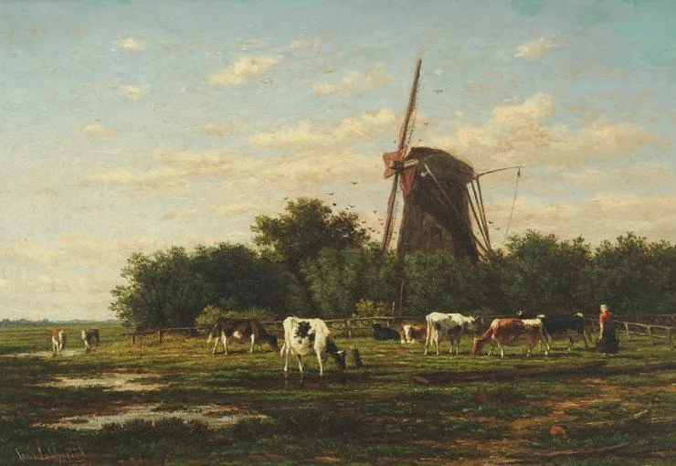 Grazende koeien rondom een molen